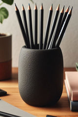 Close-up of textured round pencil holder showing organic surface detail