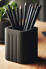 Close-up of minimalist square pencil holder with textured grooved sides