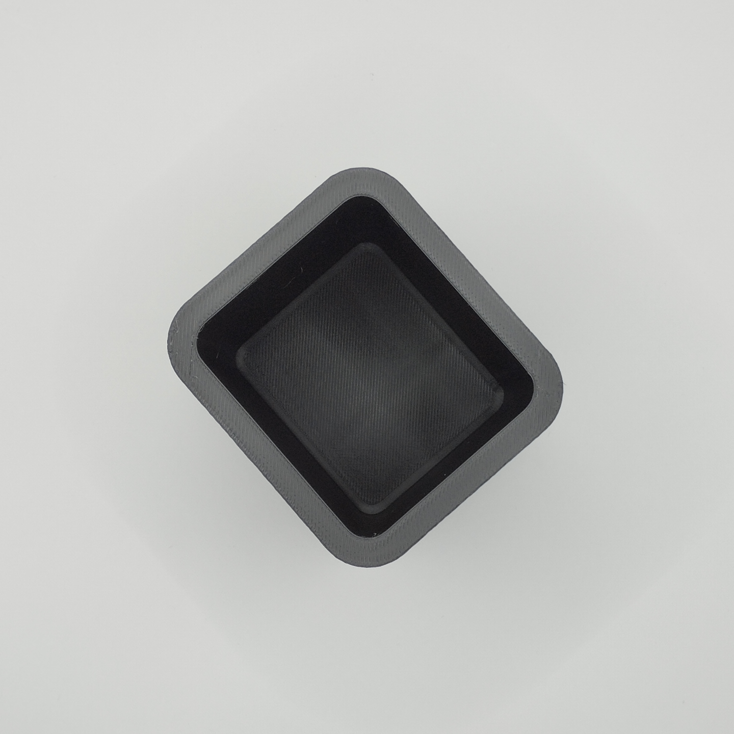 Detail of textured surface pattern on square pencil holder