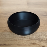 Modern key and coin catch bowl in white, top view showing smooth interior