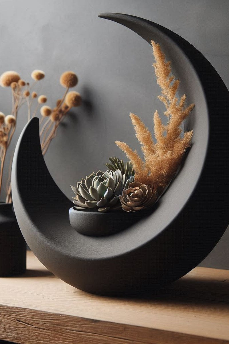 Close-up of crescent moon vase showing curved surface and integrated bowl detail