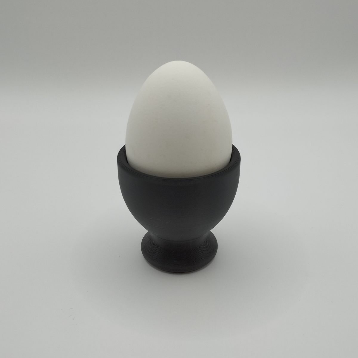 Detail of the smooth, refined surface texture of a modern egg cup