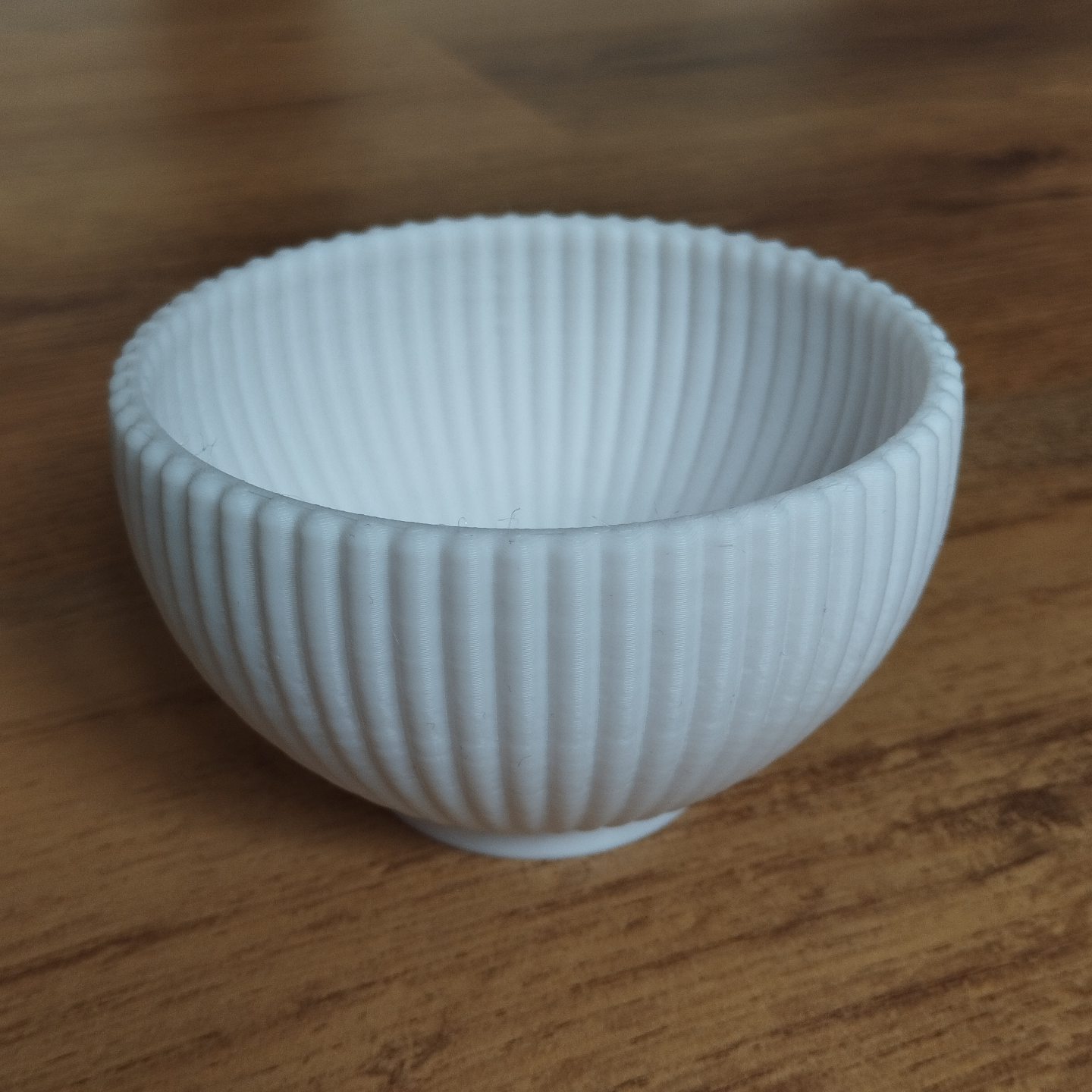 Close-up of white ribbed bowl showing vertical texture detail