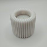 Detail of ribbed surface pattern creating light and shadow on holder
