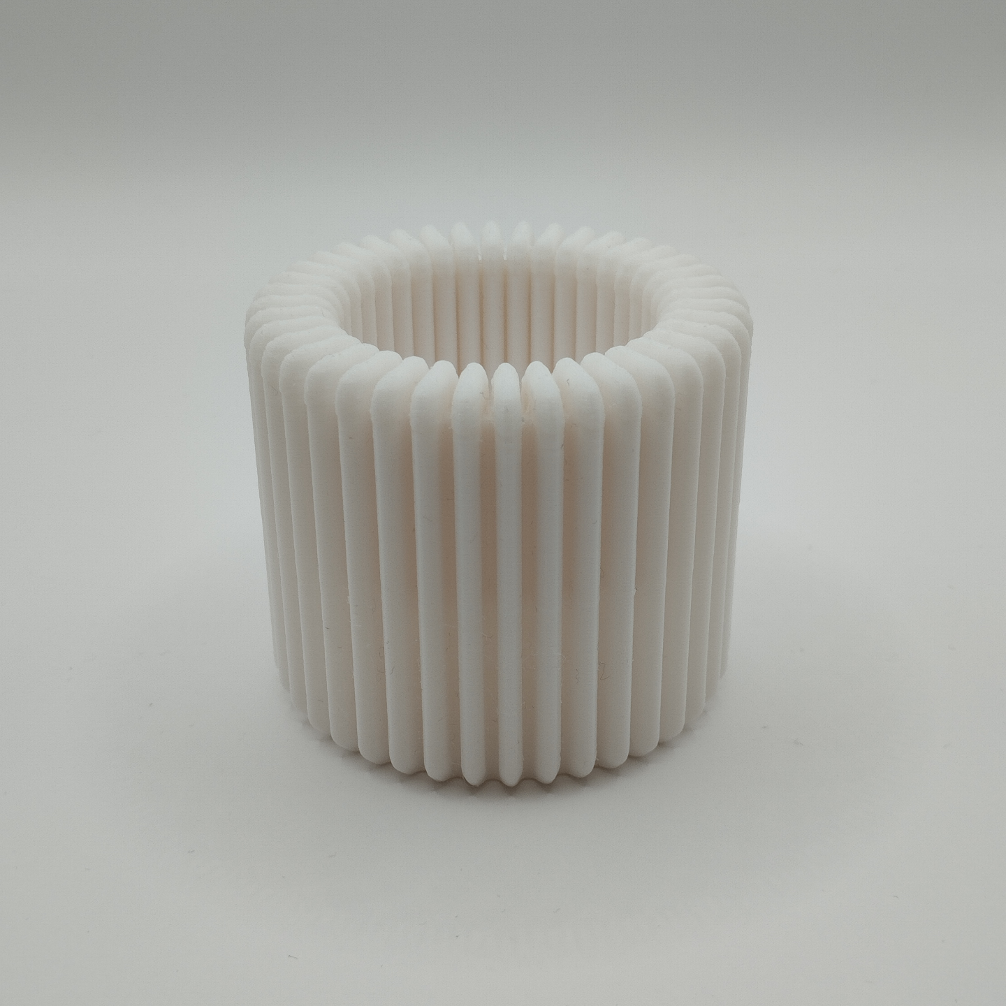 Close-up of ribbed tealight holder showing vertical texture and depth
