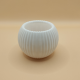 Close-up of ribbed tealight holder showing vertical texture detail