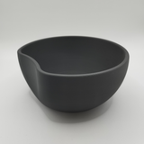 White key catcher bowl styled on entryway console with keys and coins