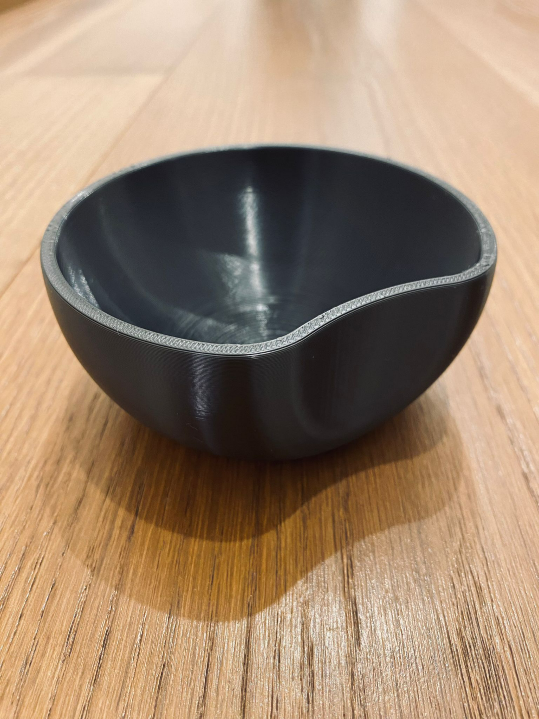 Minimalist key catcher bowl with circular cut detail, neutral finish