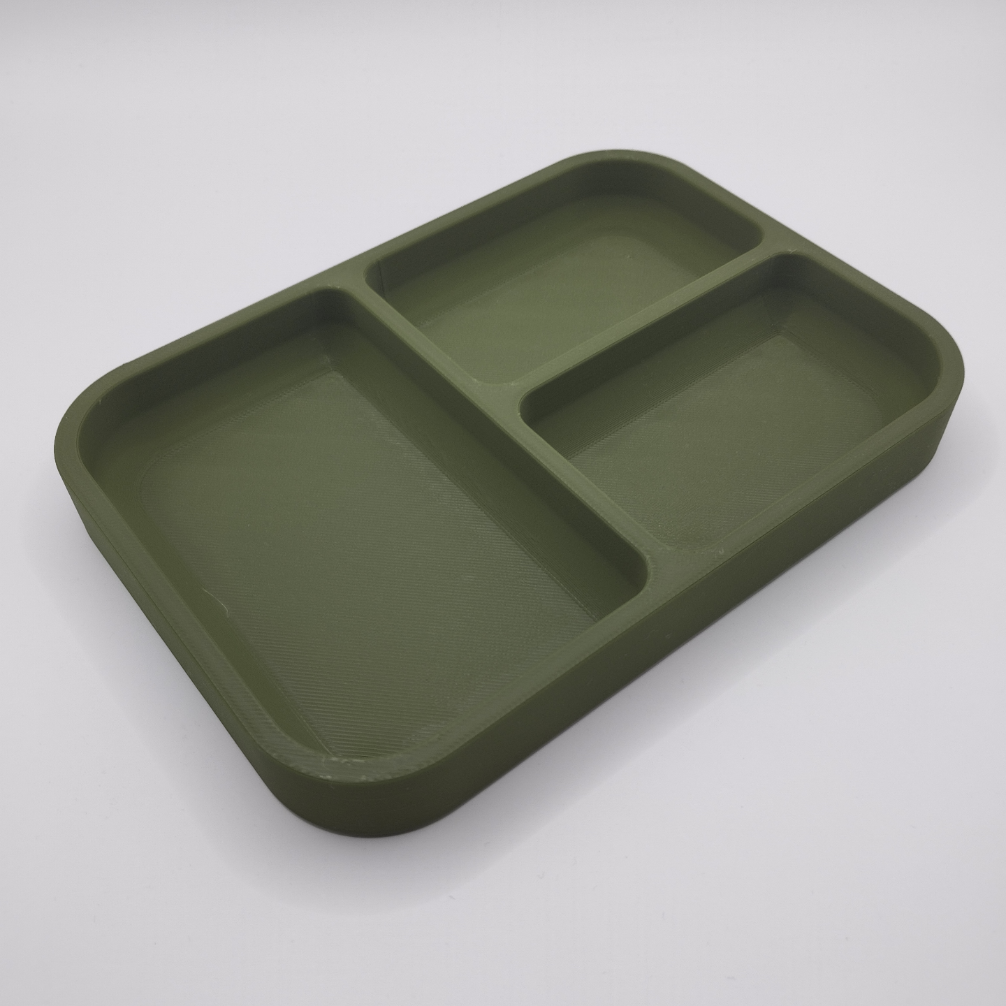 Minimalist key and coin tray displayed on a console with keys inside