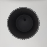 Ribbed utensil holder with vertical texture detail, close-up view