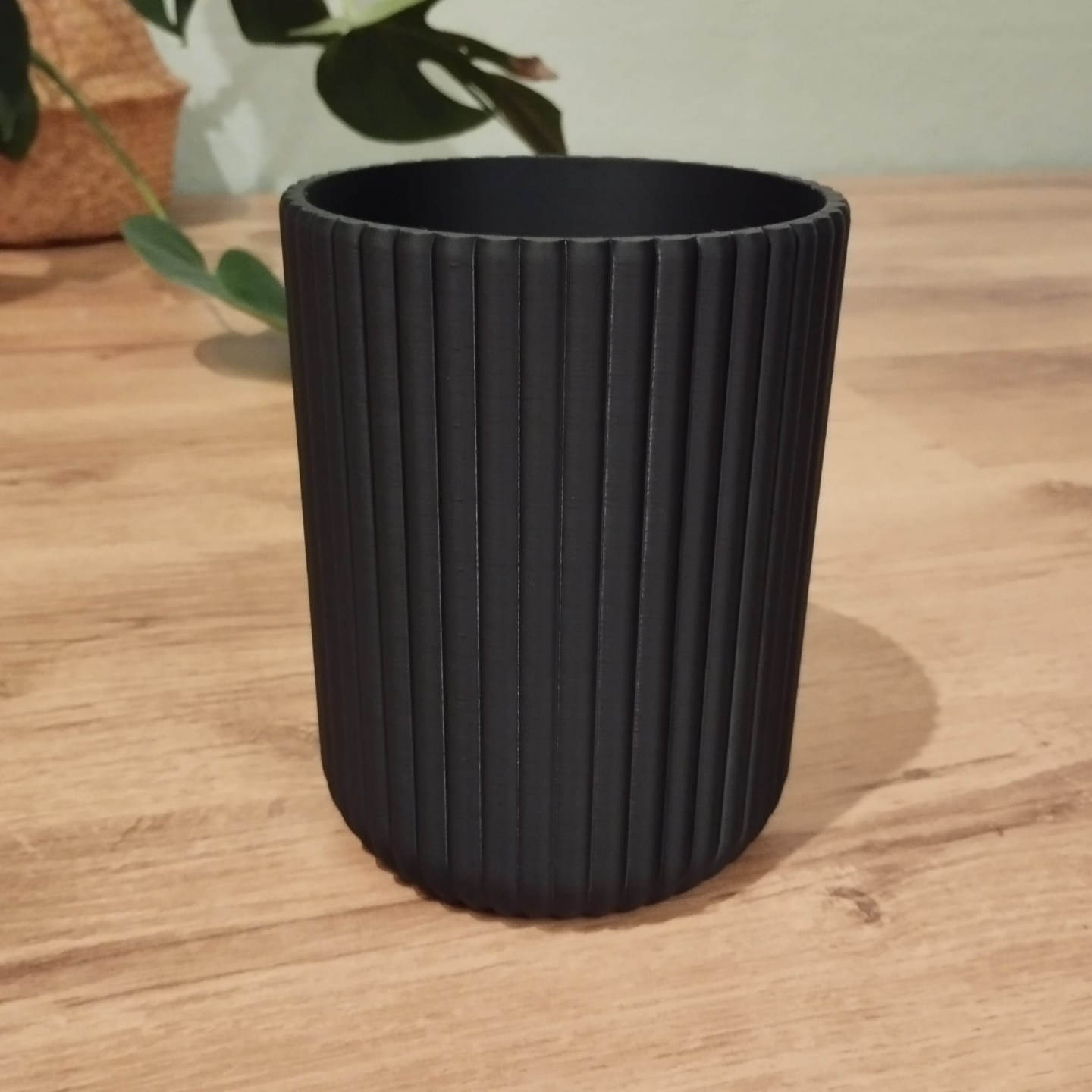 Ribbed utensil holder with vertical texture detail, close-up view