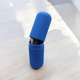 Close-up of ribbed toothbrush travel case showing textured surface detail