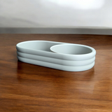 Ribbed surface detail of mid-century tray showing sliding coin bowl mechanism