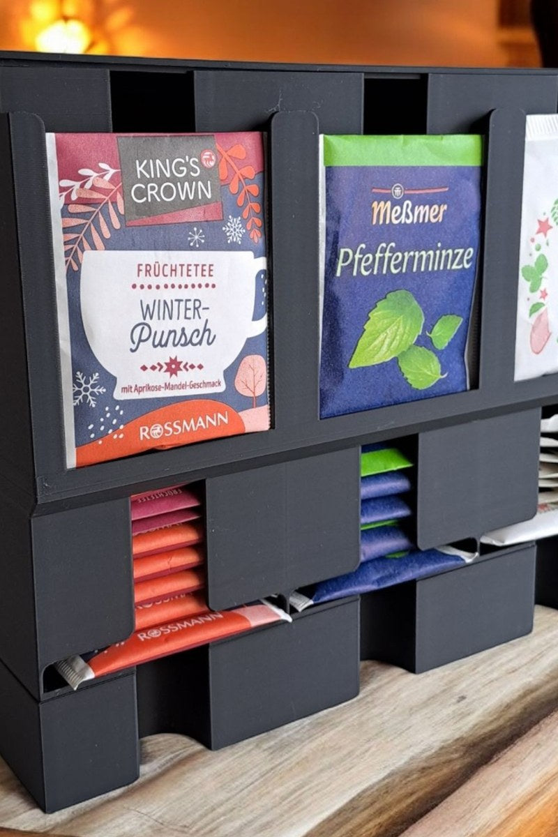 Close-up of a modern tea organizer with clean lines holding tea packages
