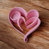 Detail of the two hearts tealight holder's textured surface and elegant geometry