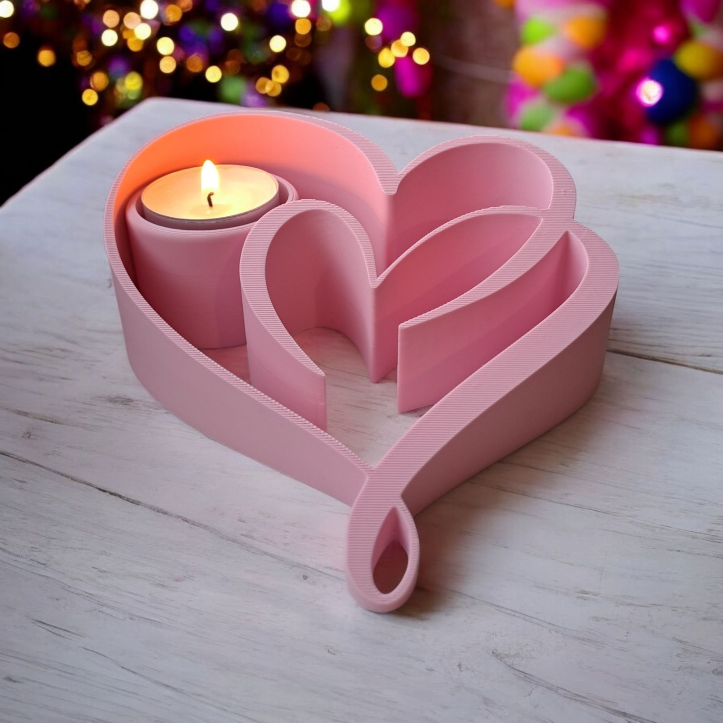 Two hearts tealight holder in close-up, showing the hollow chamber and sculptural form