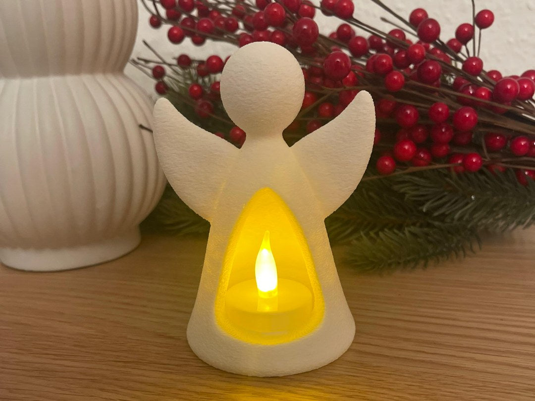 Engelfigur mit LED-Teelicht, das von innen leuchtet