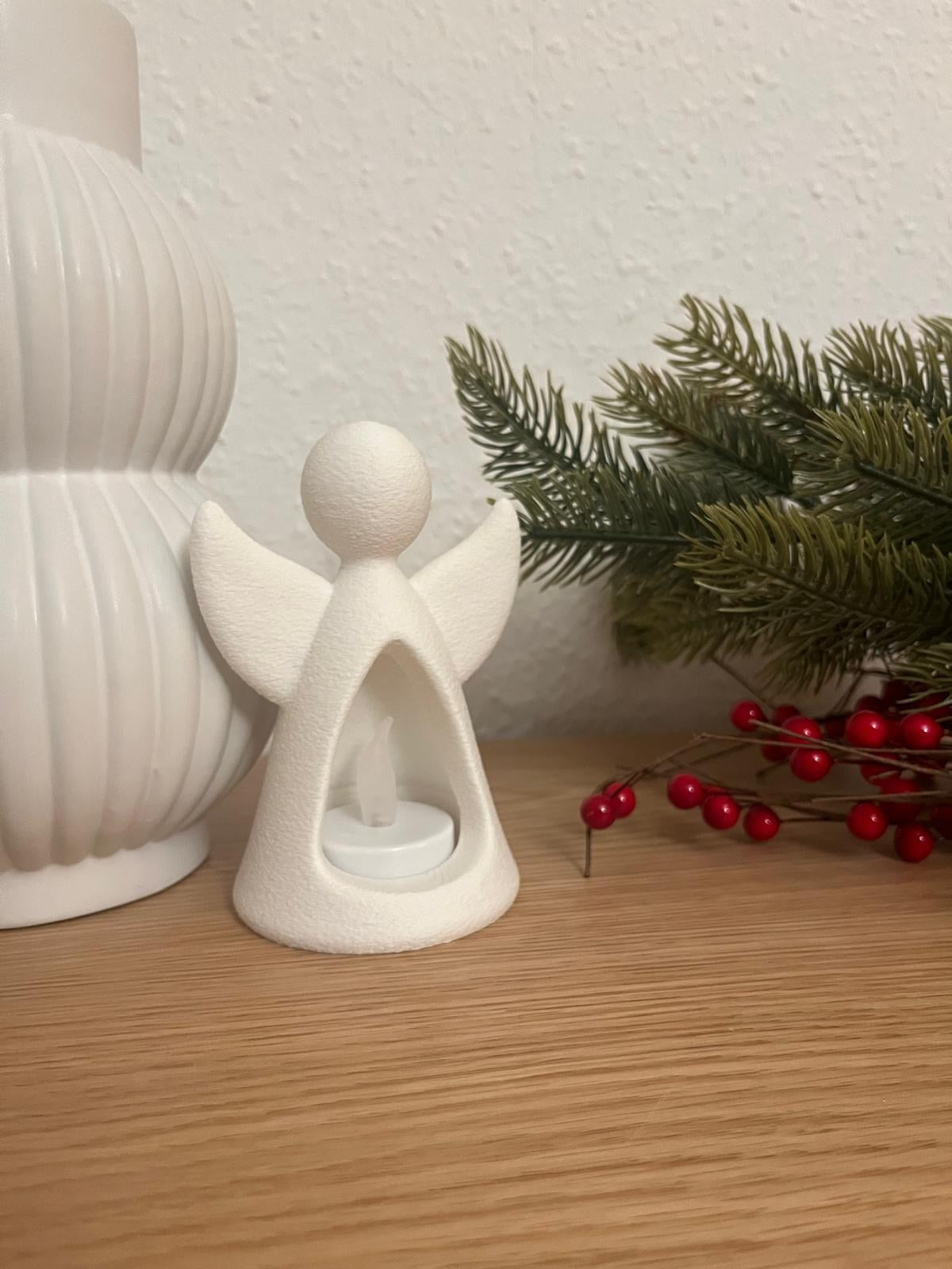 Engelfigur mit LED-Teelicht, das von innen leuchtet
