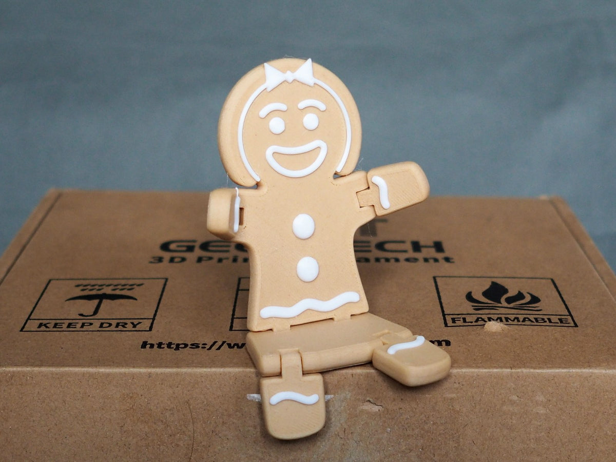 Lebkuchenfrau-Figur zu Weihnachten in Braun und Weiß