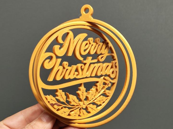 Weihnachtskugel-Gyroball mit dem Text Merry Christmas