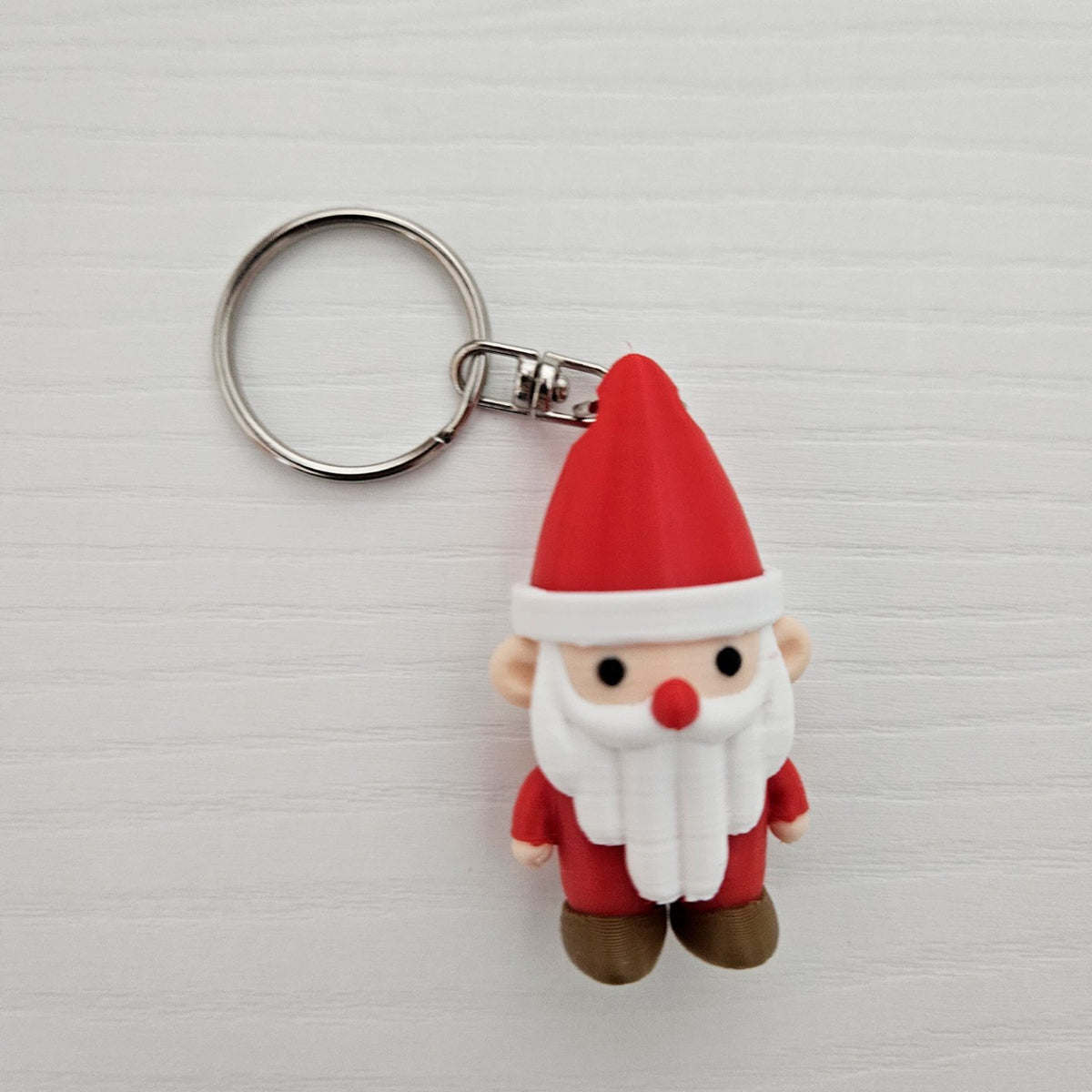 Süßer Weihnachtsmann als Schlüsselanhänger mit Loch in der Mütze