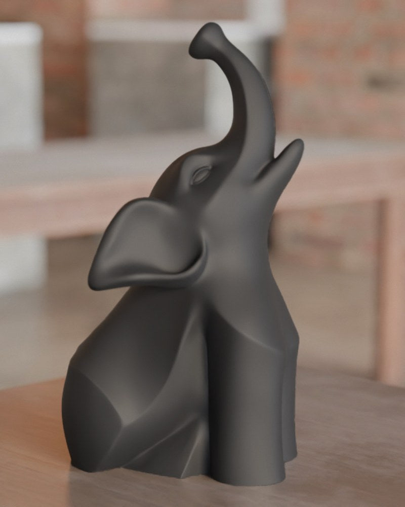 Modern elephant sculpture in black with smooth curves and geometric detailing, front view