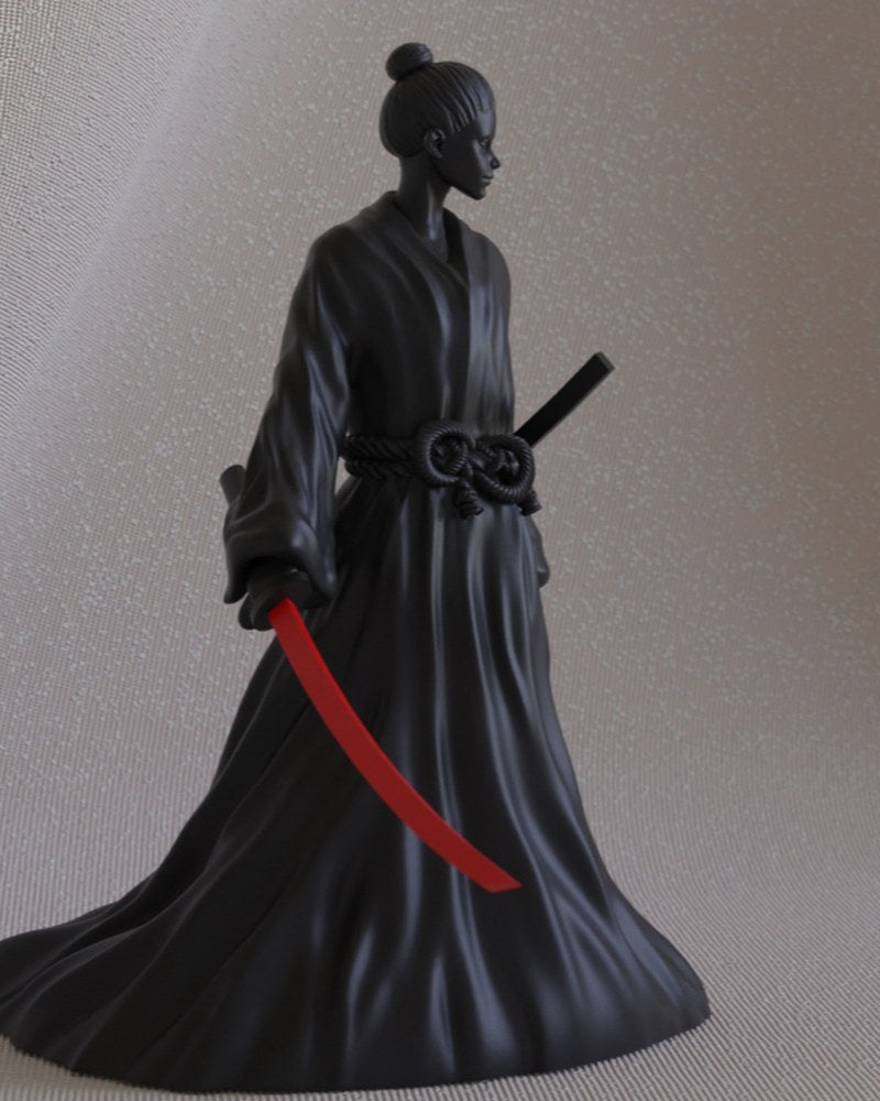 Female samurai figurine standing with katana, detailed robes, on a plain surface