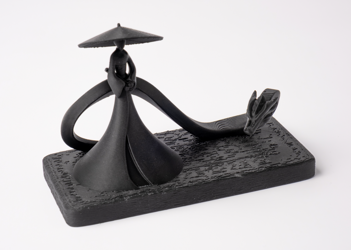 Shadow Samurai and Dragon sculpture styled on a dark wood shelf with minimal Scandinavian decor