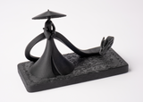 Shadow Samurai and Dragon sculpture styled on a dark wood shelf with minimal Scandinavian decor
