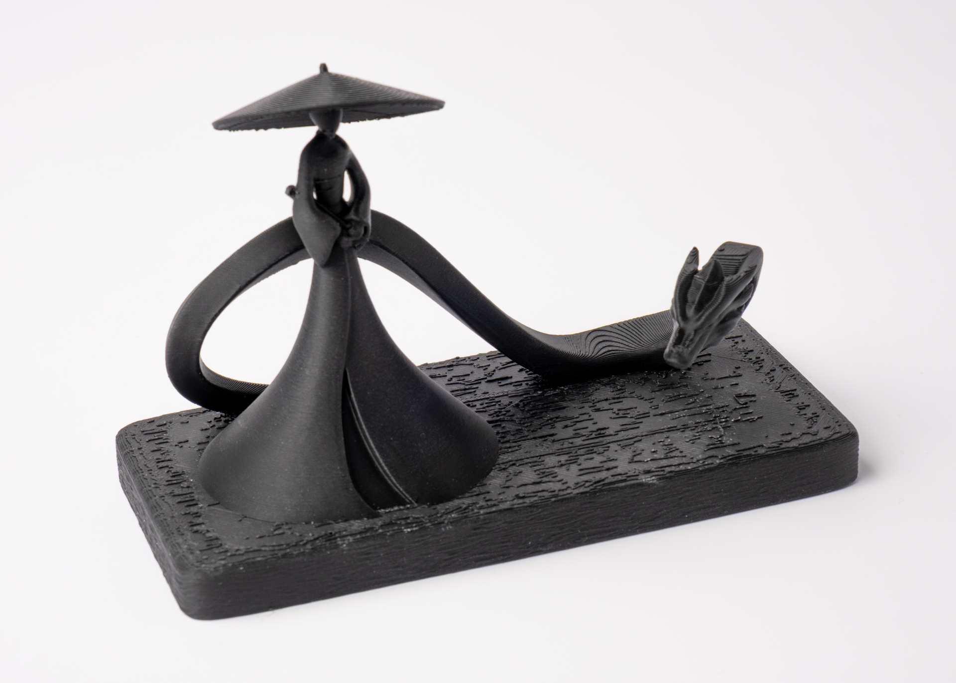 Shadow Samurai and Dragon sculpture styled on a dark wood shelf with minimal Scandinavian decor