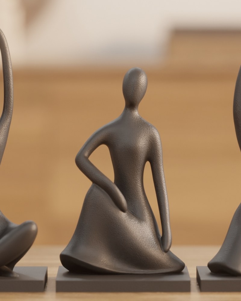 Three abstract human figure sculptures in matte finish, displayed together on a white surface