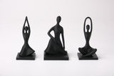 Harmony Pose Trio styled on a wooden shelf beside a small plant and ceramic bowl