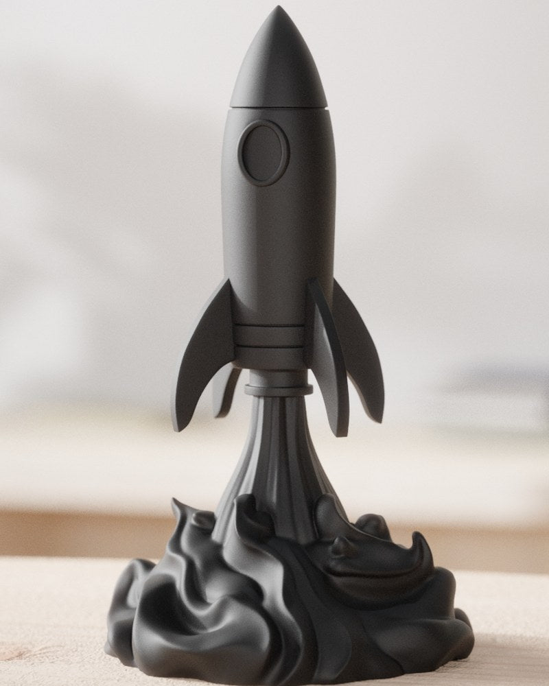 Close-up of a futuristic rocket sculpture rising from a swirling smoke base, in neutral tones