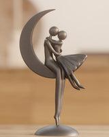 Abstract romantic couple sculpture resting on a crescent moon, white finish, front view
