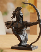 Close-up of a spartan warrior sculpture mid-draw, showing detailed posture and surface texture