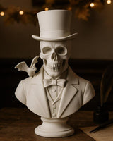 Gentleman skull bust with top hat and bow tie, small bat on shoulder, front view on white background