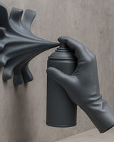 Close-up of spray paint hand sculpture showing hyper-realistic hand gripping a spray can mid-burst