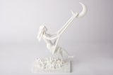 Moon swing sculpture styled on a bedroom nightstand beside a candle and dried flowers