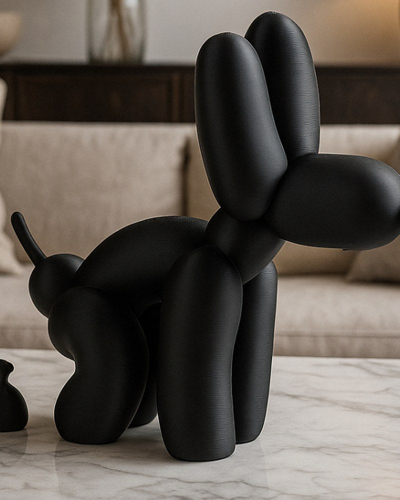 Balloon dog poop sculpture in white, shot close-up against a light background