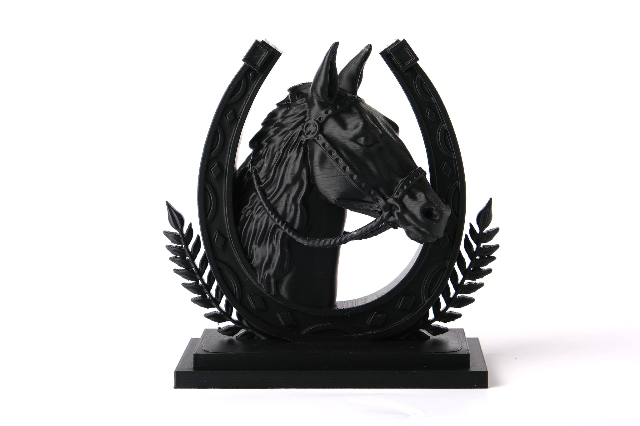 Horse sculpture styled on a wooden shelf with natural decor objects and soft light
