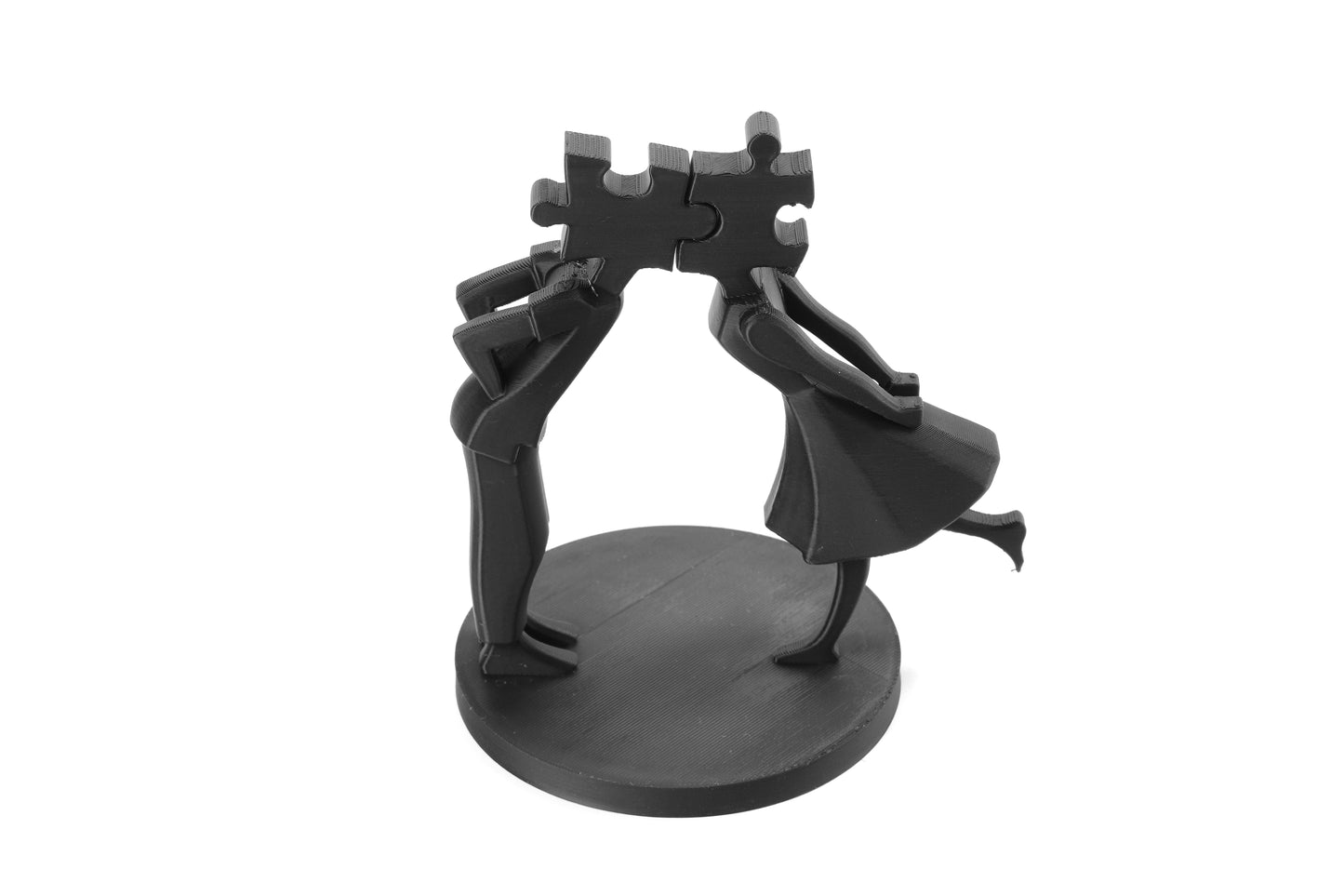 Puzzle Souls couple sculpture styled on a minimalist shelf with warm neutral tones
