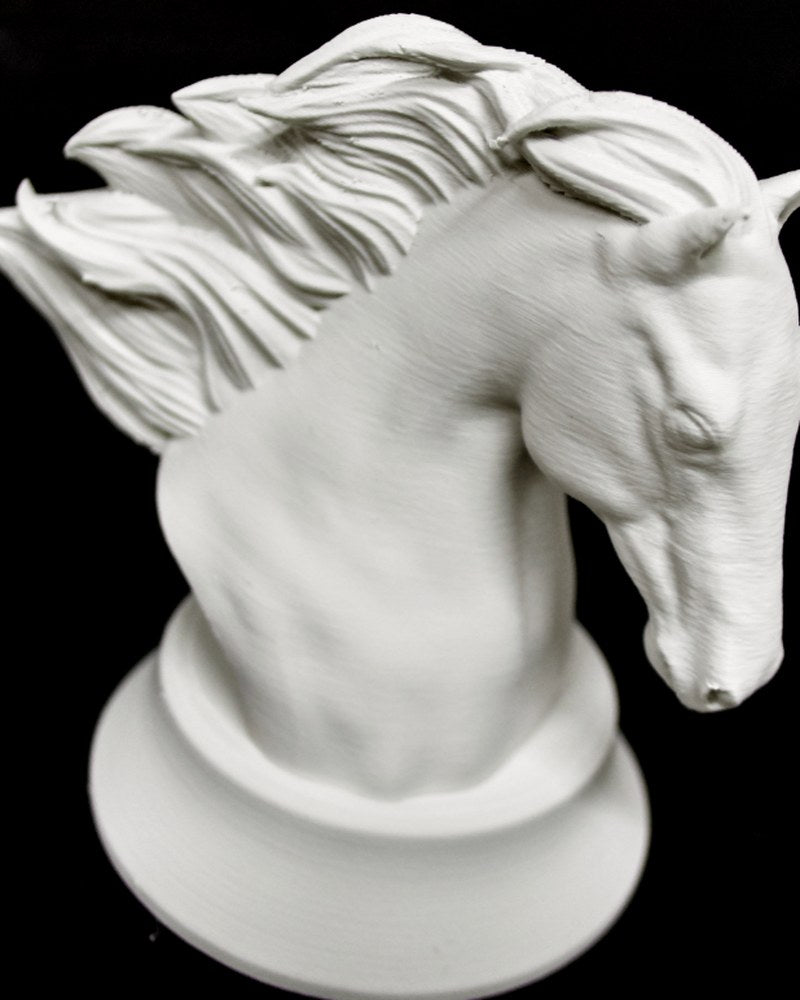 Geometric horse sculpture with faceted body and flowing mane, side view on white background