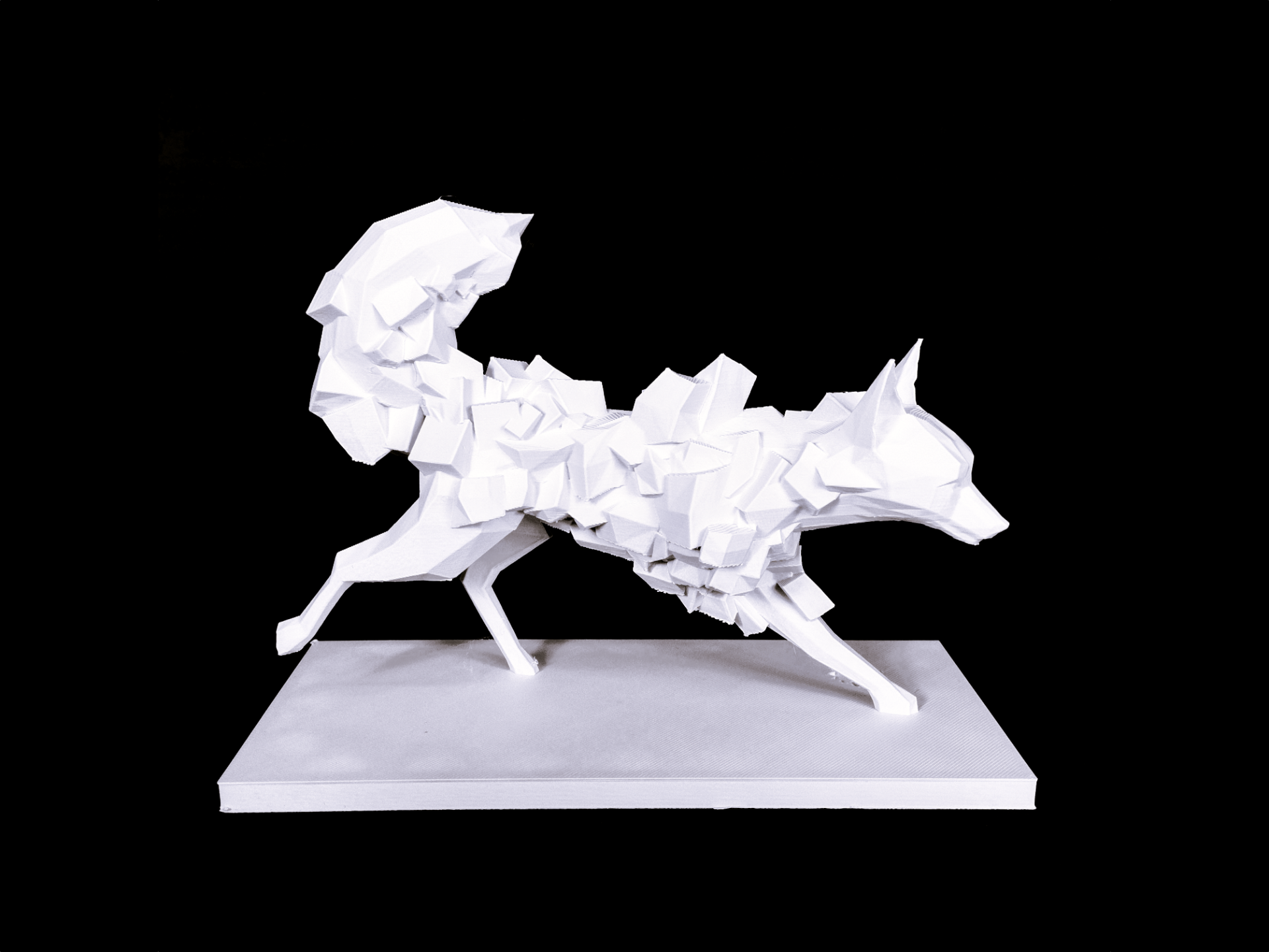 Detail shot of the sharp angular facets on a low poly fox figurine in a neutral interior