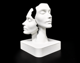 Duality faces sculpture styled on a wooden shelf in a Scandinavian living room interior