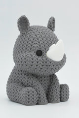 Close-up of a knitted rhino figure with soft crochet-look texture and small horns, approx. 80–100 mm