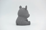 Detail of the knitted rhino surface texture showing the woven pattern and subtle ridge lines across the body