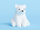 Detail shot of the knitted texture on a white polar bear figurine, showing the yarn-like surface pattern