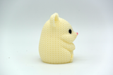 Close-up of a knitted hamster figure with a soft crochet-look texture, small round eyes and nose, 49 DKK