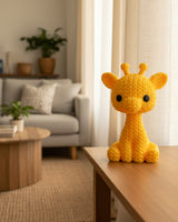 Close-up of a small knitted giraffe figurine with crochet-textured surface and expressive eyes, approx 8 cm tall