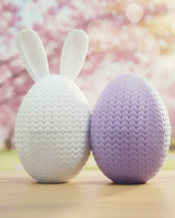 Close-up of the knitted texture detail on an Easter egg container showing soft woven surface pattern